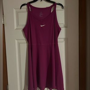 Nike tennis dresses. Green, black, purple Nike tennis dresses, size large.